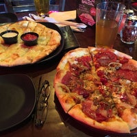 Photo taken at The Rock Wood Fired Pizza by Sean B. on 7/10/2019