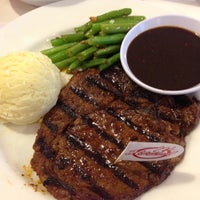 Photo taken at Holycow! Steakhouse by Am H. on 4/11/2013