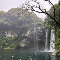 Photo taken at Cheonjiyeon Waterfall by Peng Peng on 5/29/2023