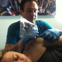 Photo taken at Skin Deep Tattoo and Body Piercing by M D. on 12/4/2012
