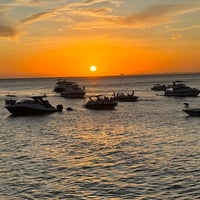 Photo taken at Praia do Porto da Barra by Vinicius F. on 12/9/2023
