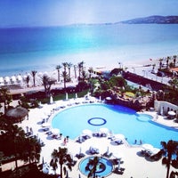 Photo taken at Sheraton Hotel Beach by Mahsun Ş. on 6/10/2014
