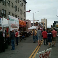 Photo taken at University District Street Fair by Shirl G. on 5/19/2013