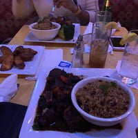 Photo taken at Reef Caribbean Restaurant And Lounge by Kojo C. on 12/8/2018