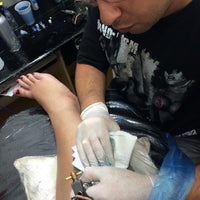 Photo taken at HK9 Tattoo by Priscila C. on 7/7/2014