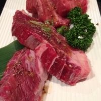 Photo taken at 焼肉本店 ドラゴ by ひがぎん on 6/21/2014