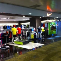Photo taken at Nike Shop @ T2 by Jackson T. on 7/31/2011