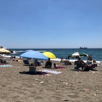 Photo taken at Playa de Baños del Carmen by Ecem O. on 6/3/2018