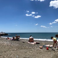 Photo taken at Playa de Baños del Carmen by Ecem O. on 6/10/2018