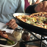 Photo taken at Boston Pizza by Özlem T. on 5/28/2018