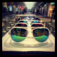 Photo taken at Ray-Ban by Надежда on 5/13/2013