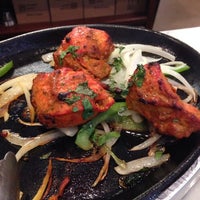 Photo taken at Asha Indian Restaurant by Debbie F. on 10/1/2014