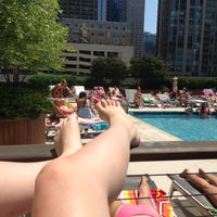 Photo taken at One Superior Place Pool Deck (One W Superior) by Laetitia H. on 6/23/2013