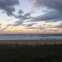 Photo taken at Praia Brava by Mariana B. on 3/30/2017