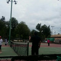 Photo taken at Canchas De Tenis (Velódromo) by Erika C. on 6/14/2015