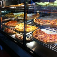 Photo taken at American Pizza Slice by Sora on 2/25/2011