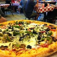 Photo taken at Carmine&amp;#39;s Pizzeria by Georgina T. on 4/6/2012