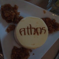 Photo taken at Athos Restaurant by Tommy C. on 2/11/2012