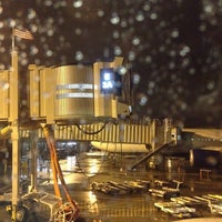 Photo taken at Gate E1 by Christopher E. on 12/10/2012
