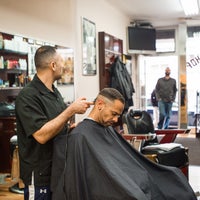 Photo taken at East 6th Street Barber Shop by Compass on 7/24/2013