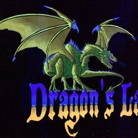 Photo taken at Dragon&amp;#39;s Lair Blacklight Indoor Golf by Bob D. on 8/31/2014