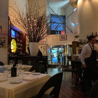 Photo taken at Remi Restaurant by Richard G. on 3/9/2019