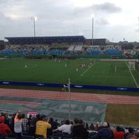 Photo taken at Stade Universite de Moncton Stadium by Tina B. on 8/9/2014