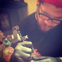 Photo taken at Unbreakable Tattoo by Ian of D. on 12/28/2012