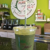 Photo taken at Pure Raw Juice Organic Juice Bar &amp;amp; Cafe by Alma A. on 3/18/2016