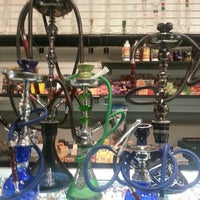 Photo taken at Dragon&amp;#39;s Den Smoke Shop by Andres O. on 7/26/2012