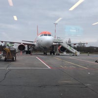 Photo taken at Gate 64 by Axel M. on 12/14/2018