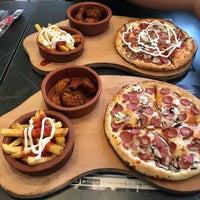 Photo taken at Pizza Tomato by Bilgin K. on 5/6/2018