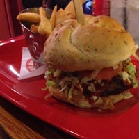 Photo taken at Red Robin Gourmet Burgers and Brews by Jason D. on 12/14/2013