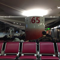 Photo taken at Gate 68 by Вероника С. on 12/19/2013