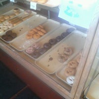 Photo taken at Baker&amp;#39;s Dozen Donuts by Charae W. on 7/1/2012