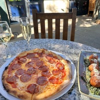 Photo taken at Pizzeria Tra Vigne by Kristine L. on 7/25/2023