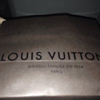 Photo taken at Louis Vuitton by Nikhita M. on 1/8/2014
