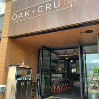 Photo taken at OAK + CRU Social Kitchen &amp;amp; Wine Bar by Spencer S. on 5/29/2019