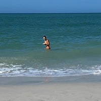 Photo taken at Naples Beach by Eleonora A. on 1/2/2022