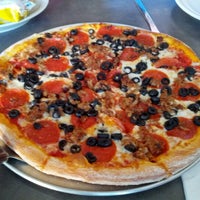 Photo taken at Vino&amp;#39;s Pizza and Italian Cuisine by Rob G. on 12/27/2012