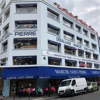 Photo taken at Marché Saint-Pierre by QUENTIN V. on 8/14/2018