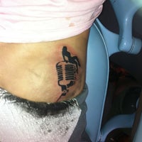 Photo taken at Los Muertos Tattoo Studio by Sarah L. on 8/5/2012