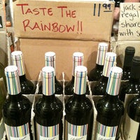 Photo taken at Sea Grape Wine Shop by Viviane P. on 4/15/2012