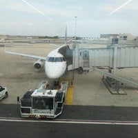 Photo taken at Gate A47 by Alessandra B. on 7/4/2012