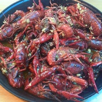 Photo taken at New LA Crawfish Boil Restaurant by Jenny W. on 6/1/2013
