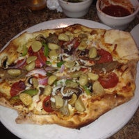 Photo taken at Louisiana Pizza Kitchen by Liz M. on 6/6/2014