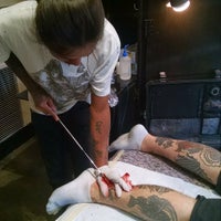 Photo taken at Under the Needle Tattoos by Josh S. on 8/18/2015