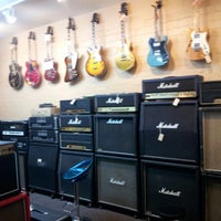 Photo taken at Cowtown Guitars by Pat H. on 12/28/2012