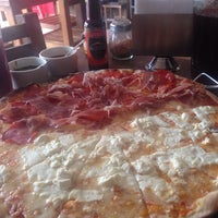 Photo taken at Buruz Pizza &amp;amp; Vino by Alejandra R. on 7/18/2014
