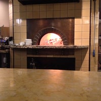 Photo taken at Olio Wood Fired Pizzeria by Aaron H. on 12/22/2012